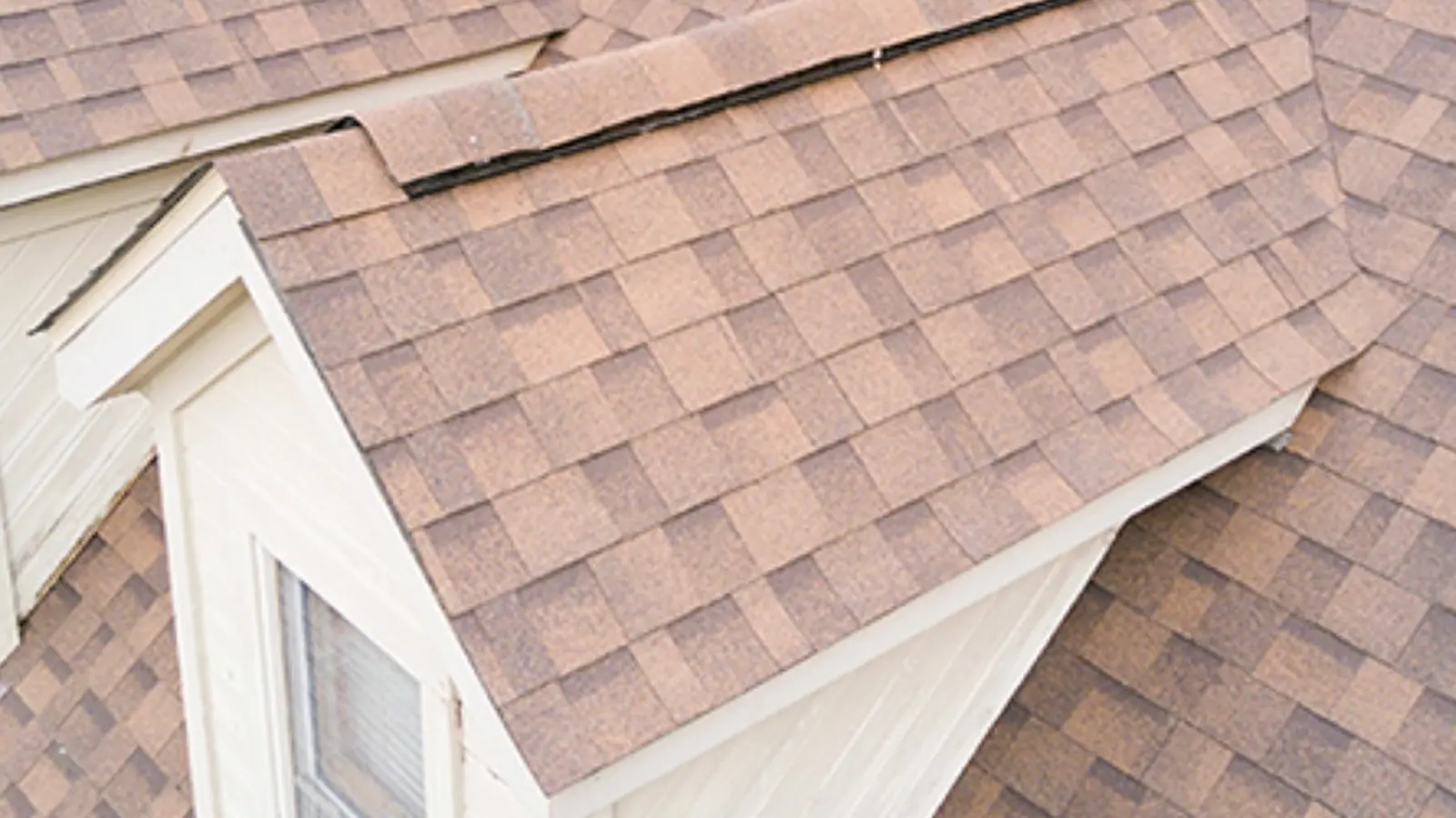 Close view of a finished architectural shingle roof and dormer on a Midlands South Carolina home