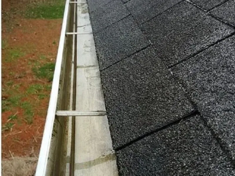 The same gutter clear and free-flowing after a pine needle cleanout