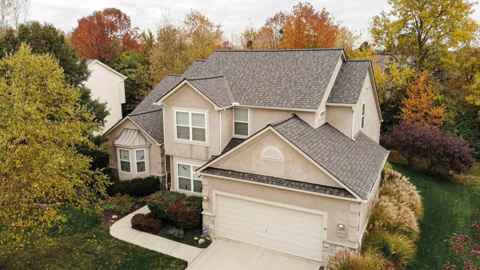 Aerial view of a two-story Midlands South Carolina home after a completed architectural shingle roof replacement